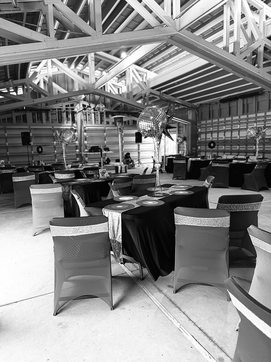 A&A Events venue with disco ball centerpiece